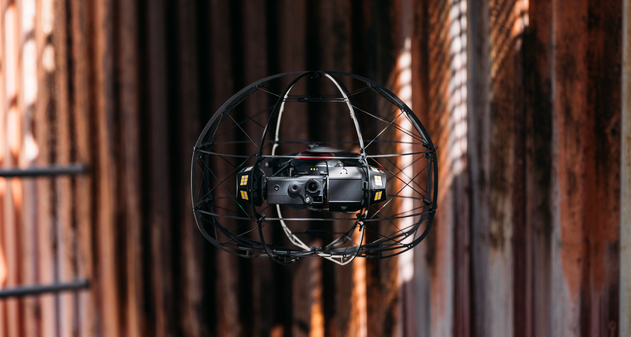 Flybotix-ASIOX-Drone-flying-Metal-Background